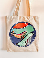 Linen library bag featuring Indigenous art of dolphins or whales, a practical and cultural keepsake.
