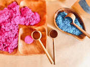 teak teaspoon scoops: natural wooden scoops for children’s activities.