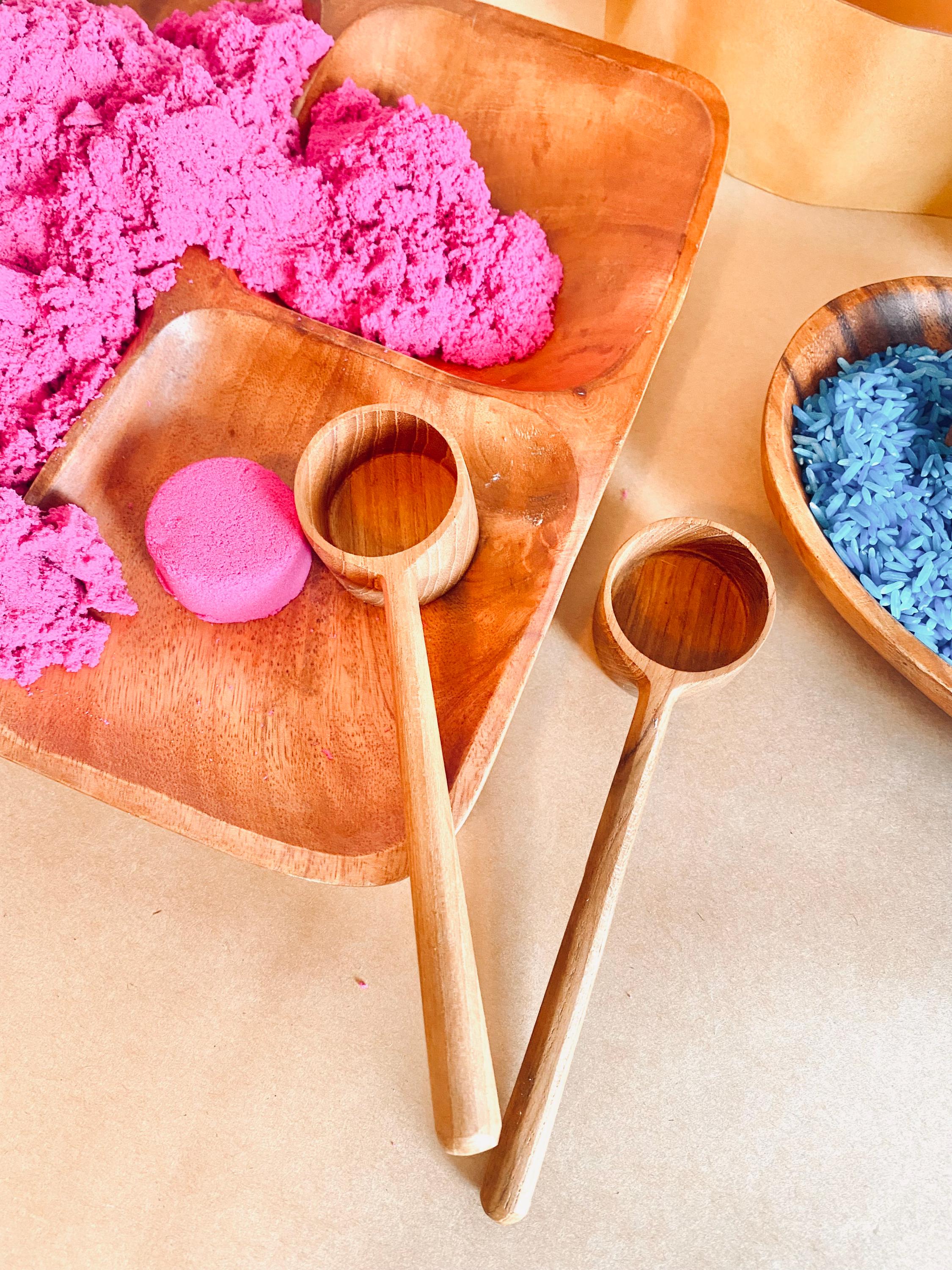 teak teaspoon scoops: natural wooden scoops for children’s activities.