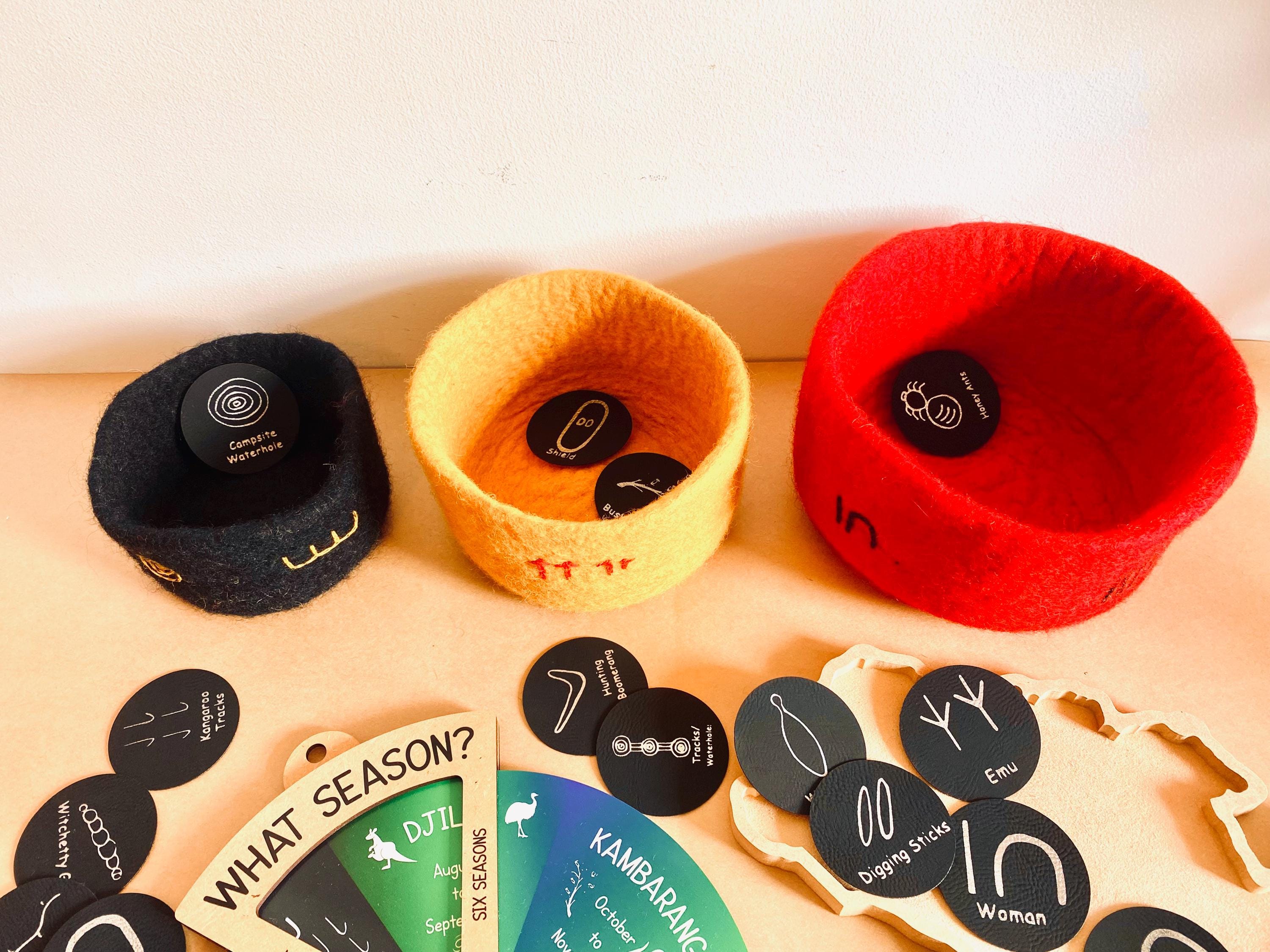 Indigenous nested bowl set in Australian flag colors, adorned with cultural symbols for NAIDOC Week.