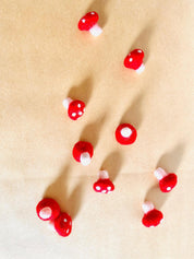 Felt Mushrooms: Red and white felt mushrooms for fairy garden play.