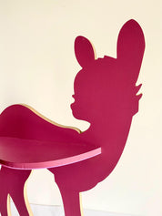 Burgundy wooden deer shelf with hooks, ideal for kids' rooms or adding rustic charm to any space. Customizable options available.