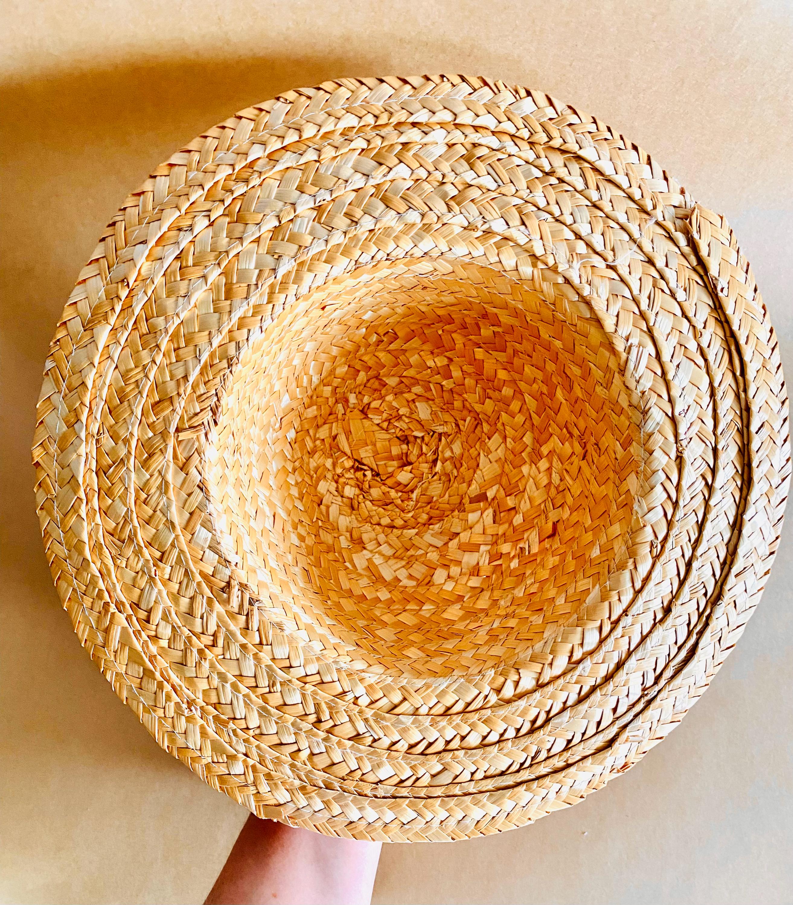 Plain straw hat with a pink ribbon, perfect for doll dress-up or adding rustic charm to decor projects.