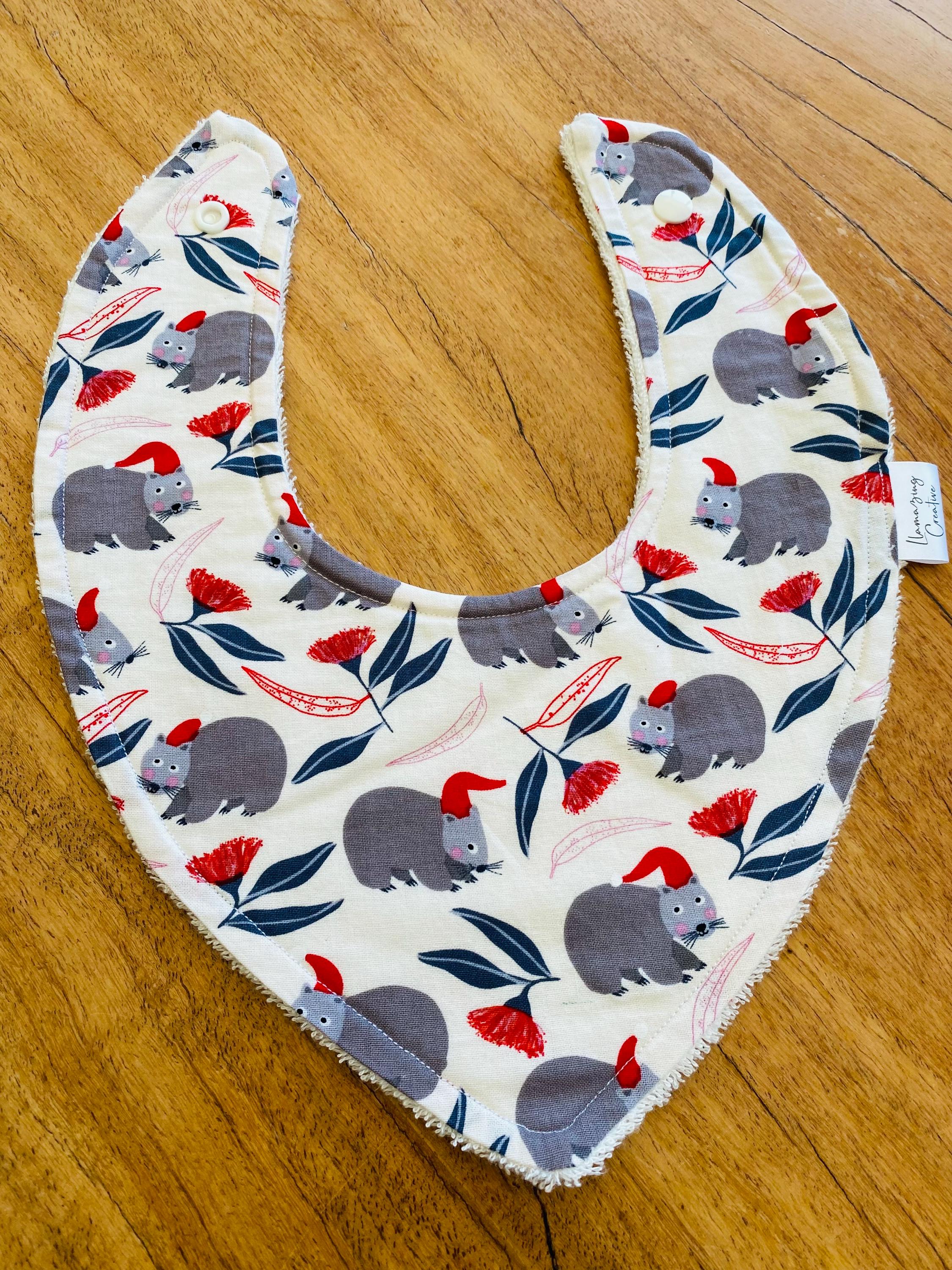 Christmas WOMBAT Bib: Baby bib with a festive wombat design.