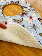 Butterfly Collection Bib: Handmade bib featuring butterfly illustrations.