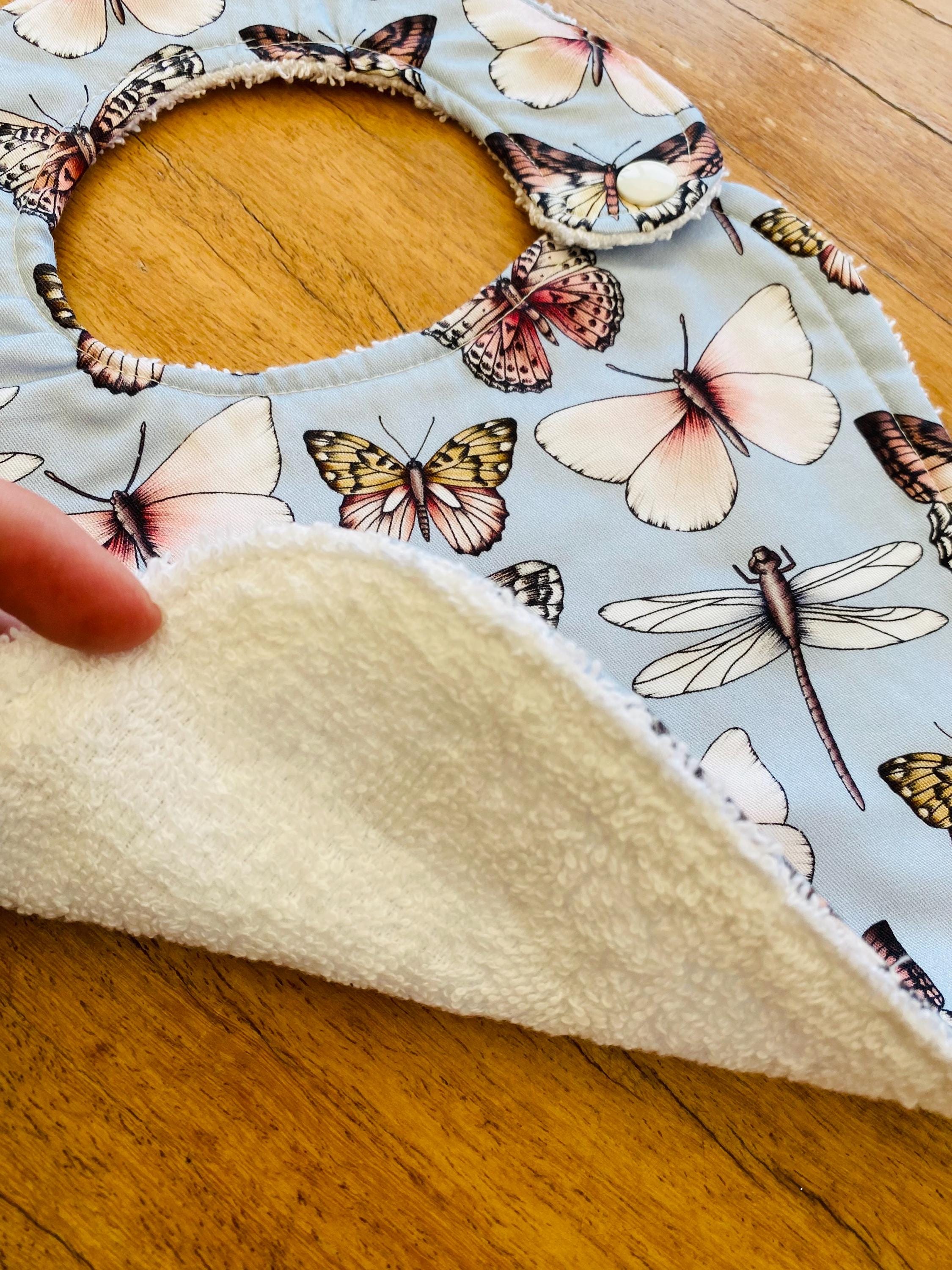 Butterfly Collection Bib: Handmade bib featuring butterfly illustrations.
