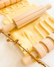 Set of 3 Patterned Rolling Pins: Wooden rolling pins with various patterns for creative play.