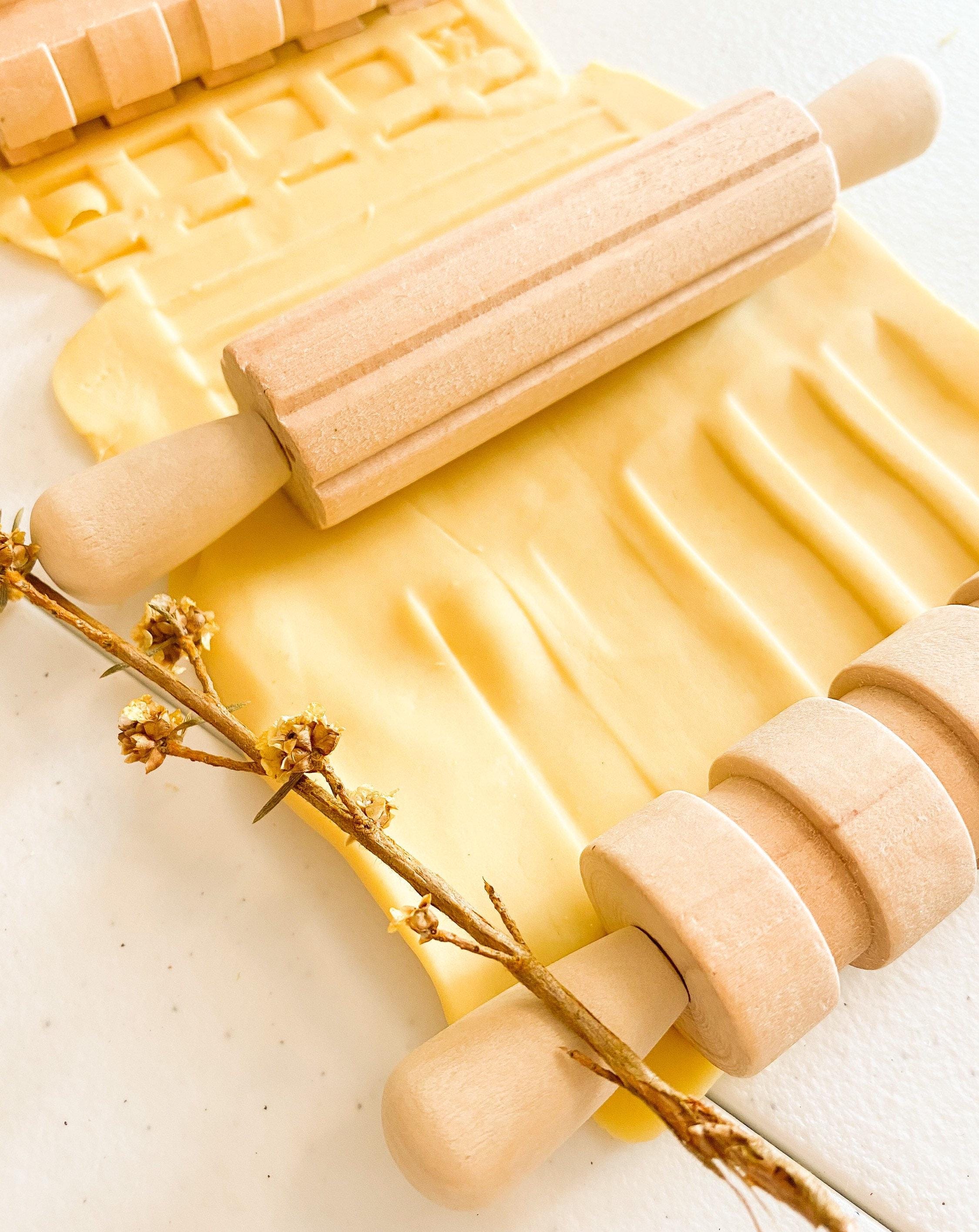 Set of 3 Patterned Rolling Pins: Wooden rolling pins with various patterns for creative play.