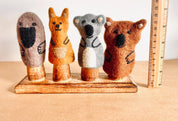 Wooden Finger Puppet Stand: Wooden stand with prongs for organizing finger puppets.