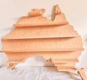 Natural Australian-shaped wall shelf, a stunning and functional home decor piece.
