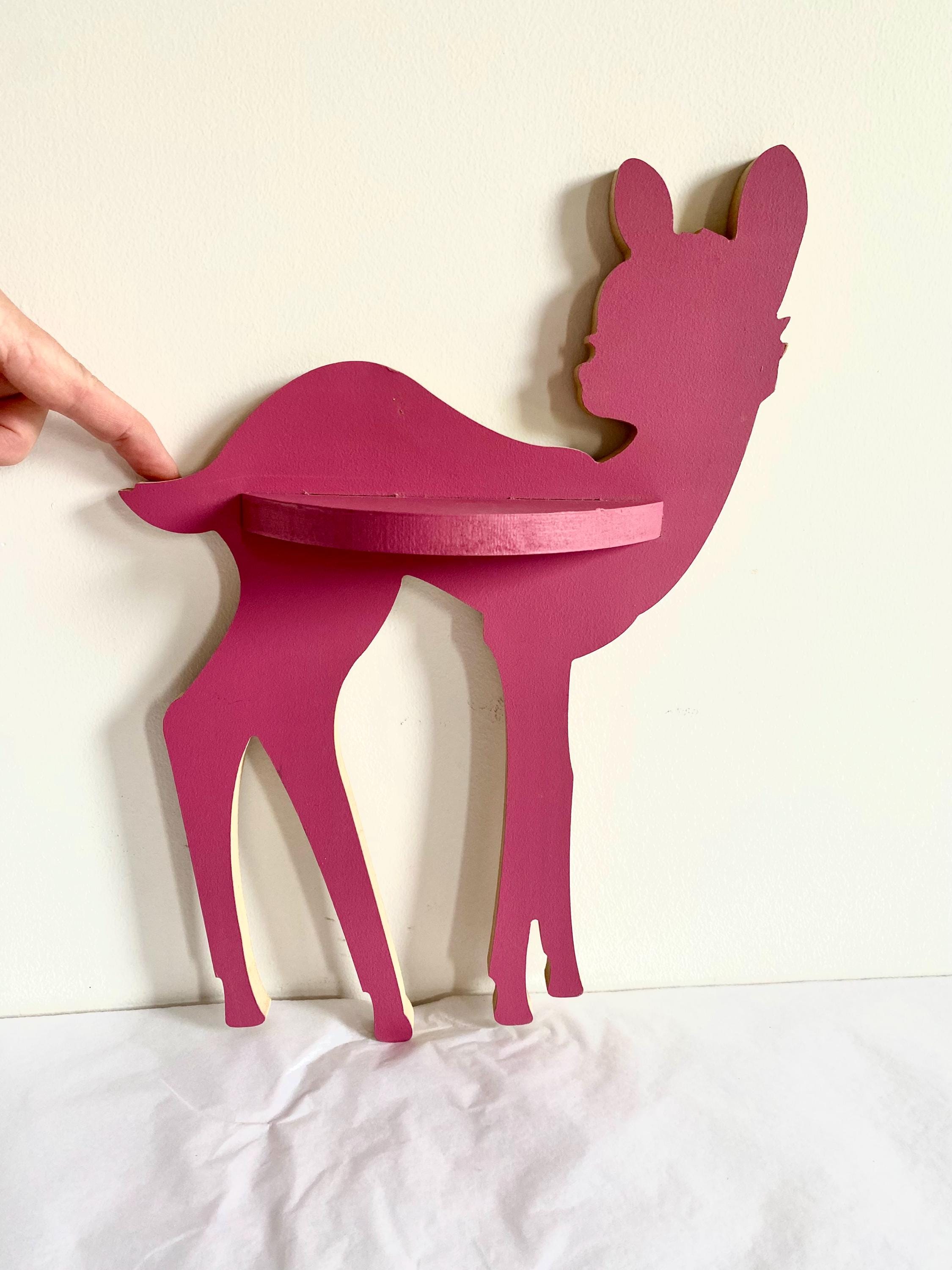 Burgundy wooden deer shelf with hooks, ideal for kids' rooms or adding rustic charm to any space. Customizable options available.