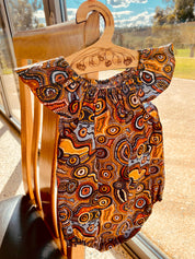 Indigenous Cotton Flutter Playsuit: Handmade Jijaka indigenous cotton flutter playsuit featuring an Australian-inspired design.