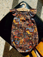 Indigenous Cotton Flutter Playsuit: Handmade Jijaka indigenous cotton flutter playsuit featuring an Australian-inspired design.