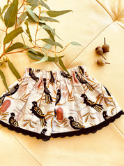 Black Cockatoo Skirt: Australian-themed cotton skirt with a black cockatoo pattern, handmade with a touch of charm.