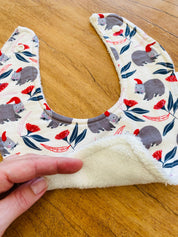 Christmas WOMBAT Bib: Baby bib with a festive wombat design.