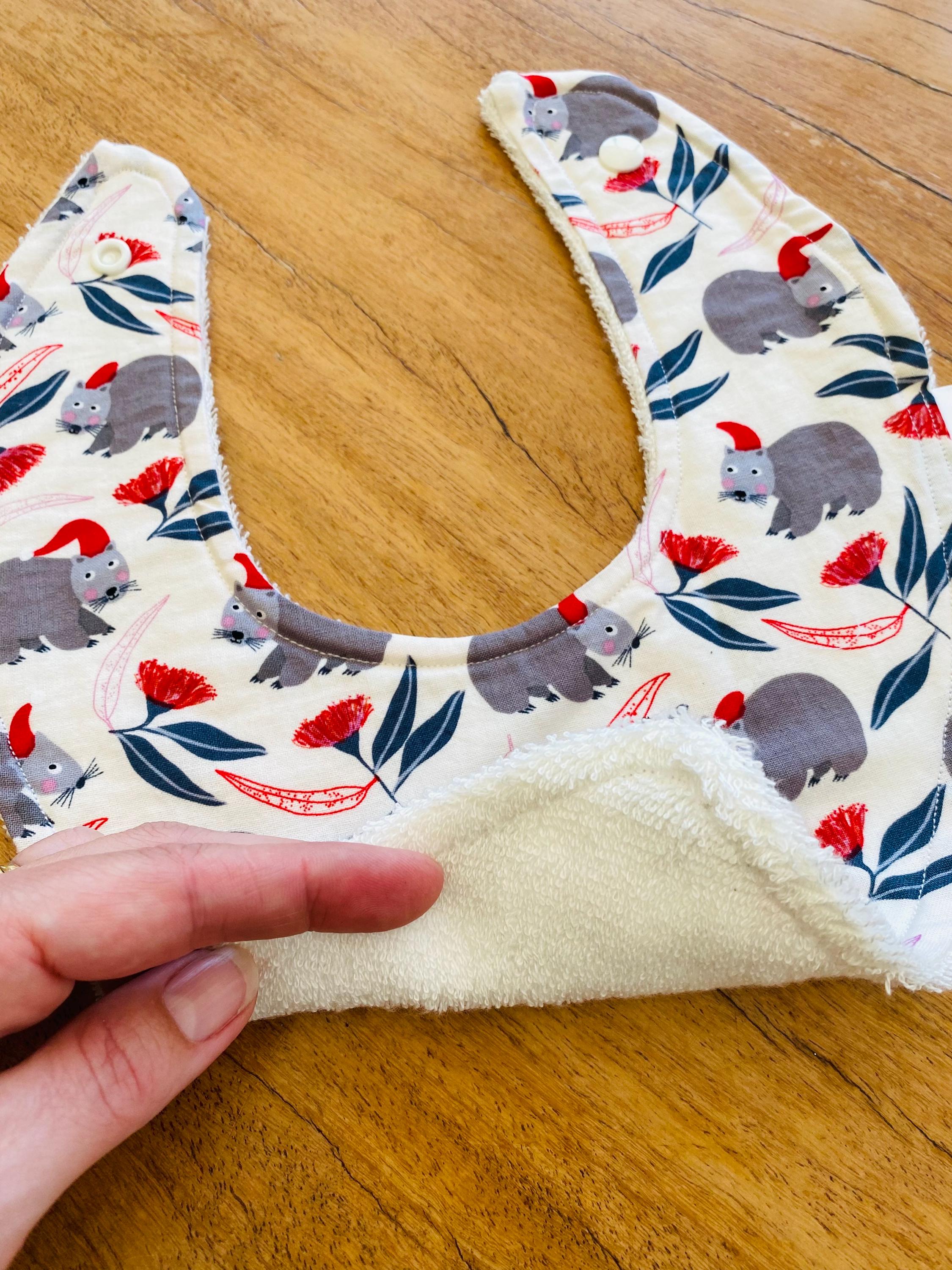 Christmas WOMBAT Bib: Baby bib with a festive wombat design.