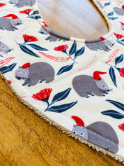 Christmas WOMBAT Bib: Baby bib with a festive wombat design.
