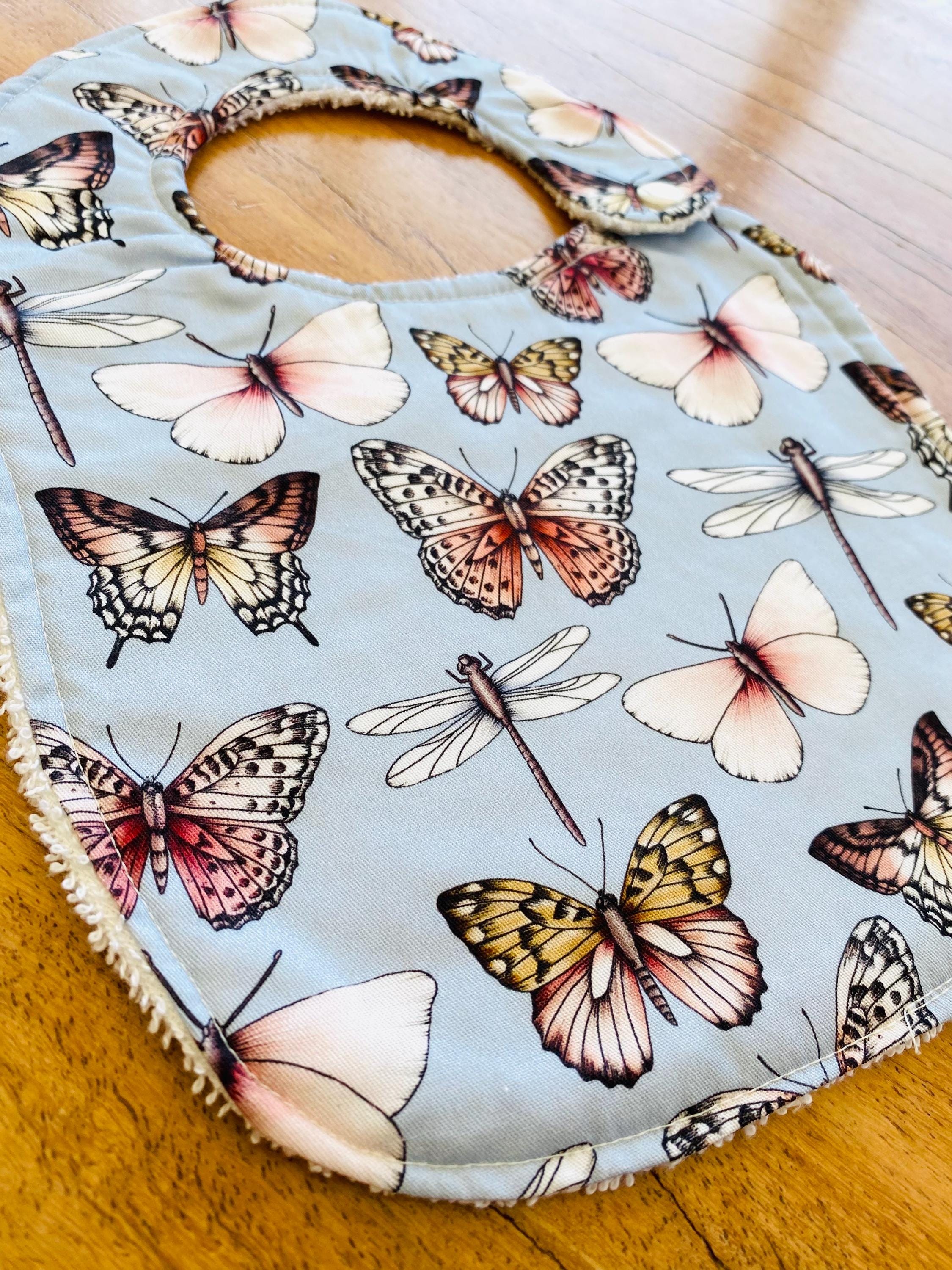 Butterfly Collection Bib: Handmade bib featuring butterfly illustrations.