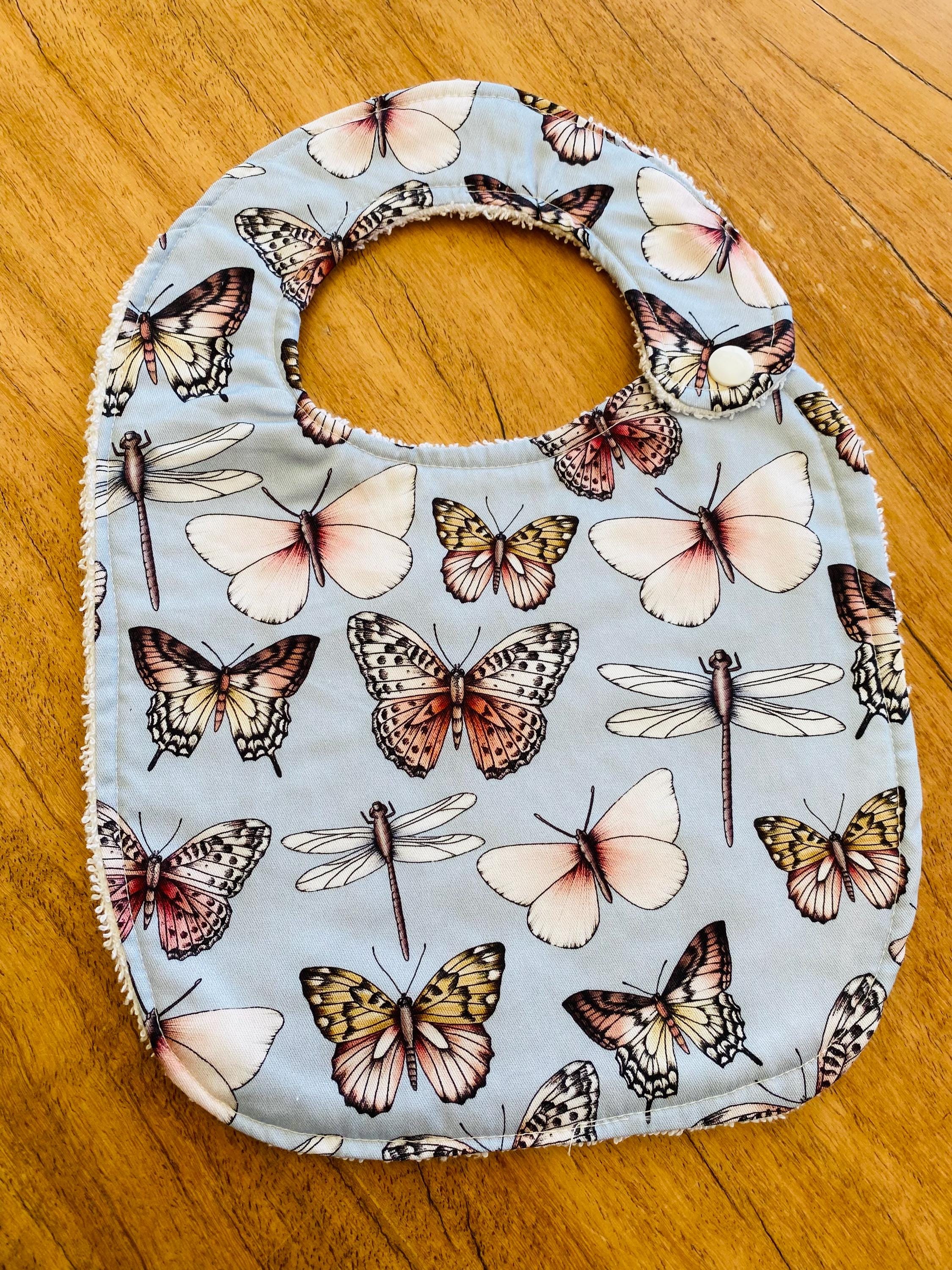 Butterfly Collection Bib: Handmade bib featuring butterfly illustrations.