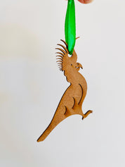 Cockatoo Ornament: Wooden ornament of a cockatoo for Christmas decorations.