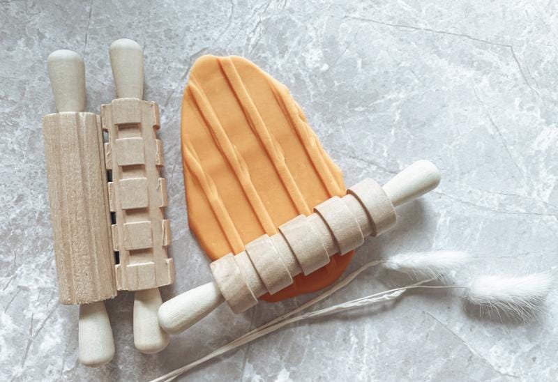 Set of 3 Patterned Rolling Pins: Wooden rolling pins with various patterns for creative play.