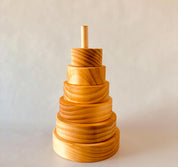 Natural Wooden Stacker: Customizable stacker with a personalized name option.