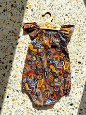Indigenous Cotton Flutter Playsuit: Handmade Jijaka indigenous cotton flutter playsuit featuring an Australian-inspired design.