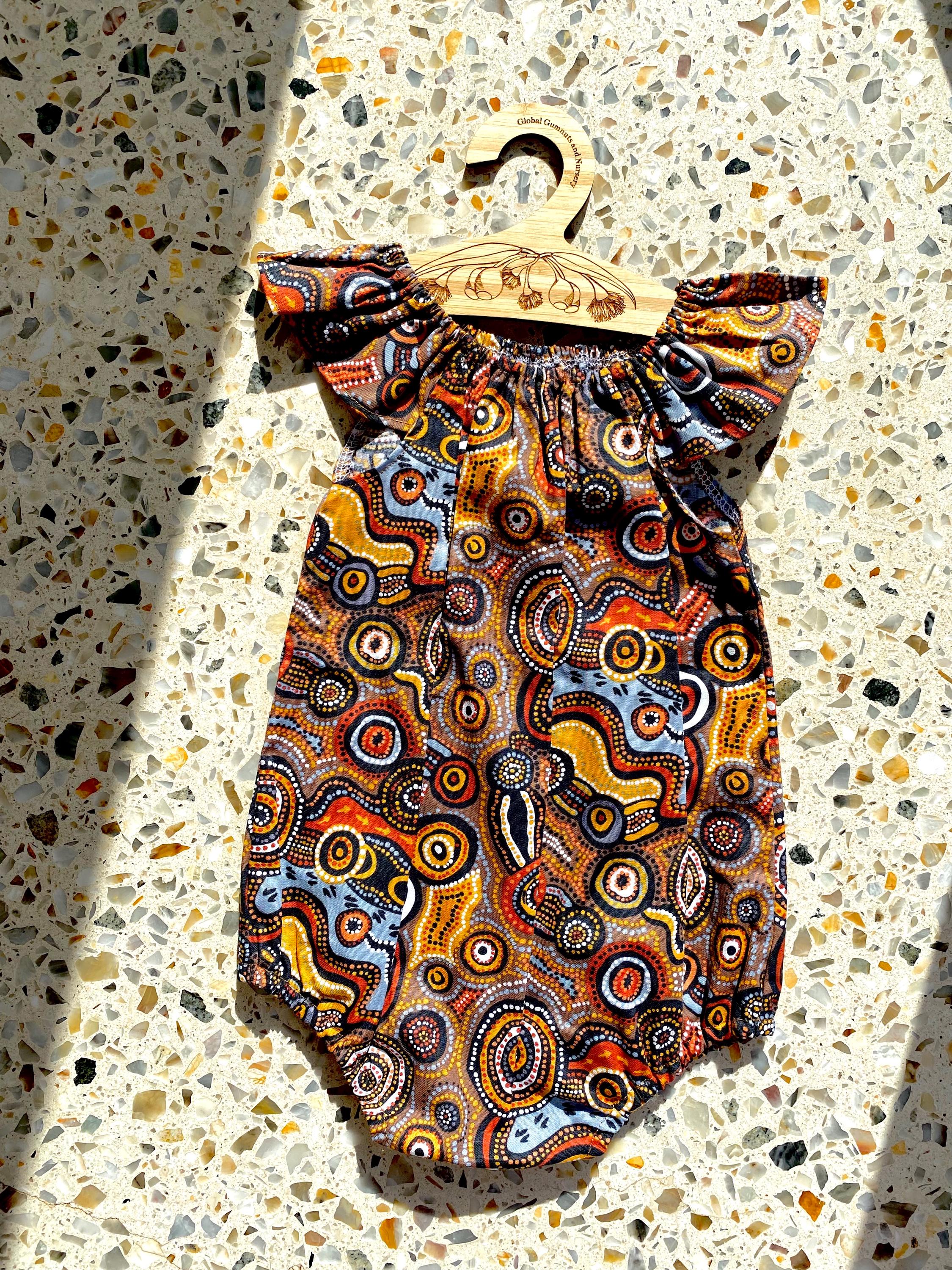 Indigenous Cotton Flutter Playsuit: Handmade Jijaka indigenous cotton flutter playsuit featuring an Australian-inspired design.