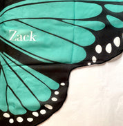 Vibrant butterfly wings for kids, custom chiffon designs with glitter and sparkle, perfect for dress-up or dance.