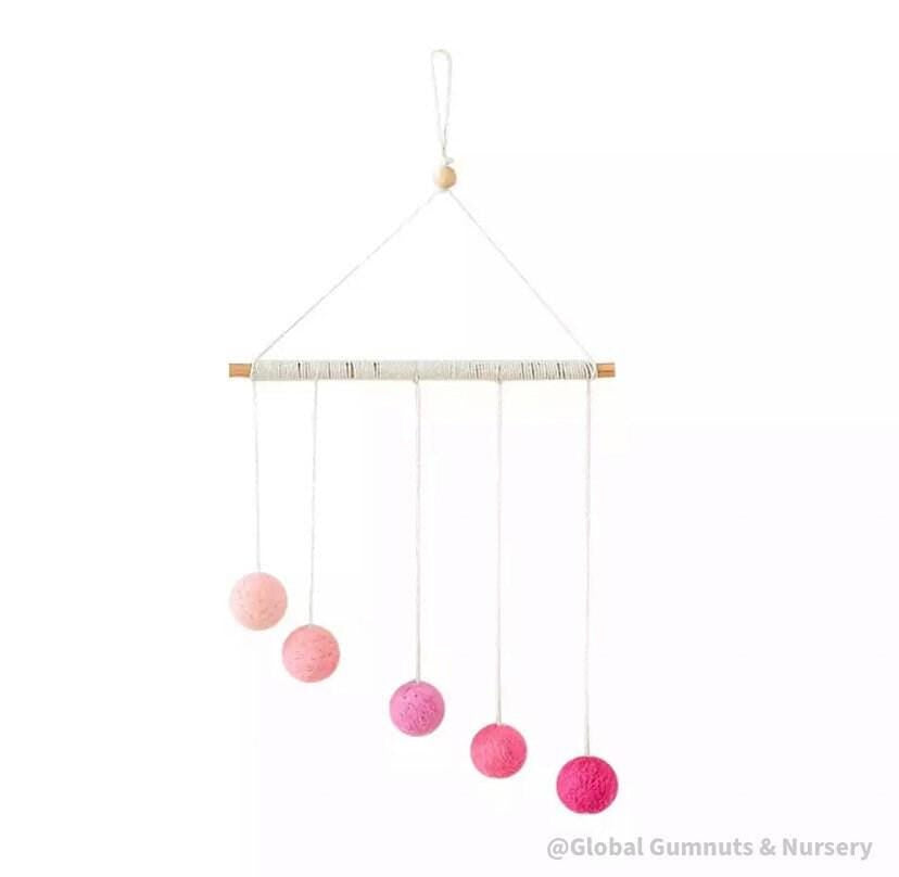 Montessori-inspired color bar baby mobile in pink, an eco-friendly and soothing nursery decor.