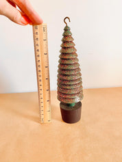 Glittery handmade wooden Christmas trees, creating a magical forest decor for the holiday season.