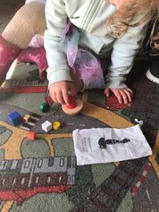 Colorful 8-piece wooden geometric block balancing game. Perfect for improving motor skills and encouraging STEM learning through play.