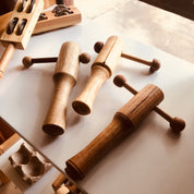 Tik Tok wooden shaker, a handmade musical instrument.
