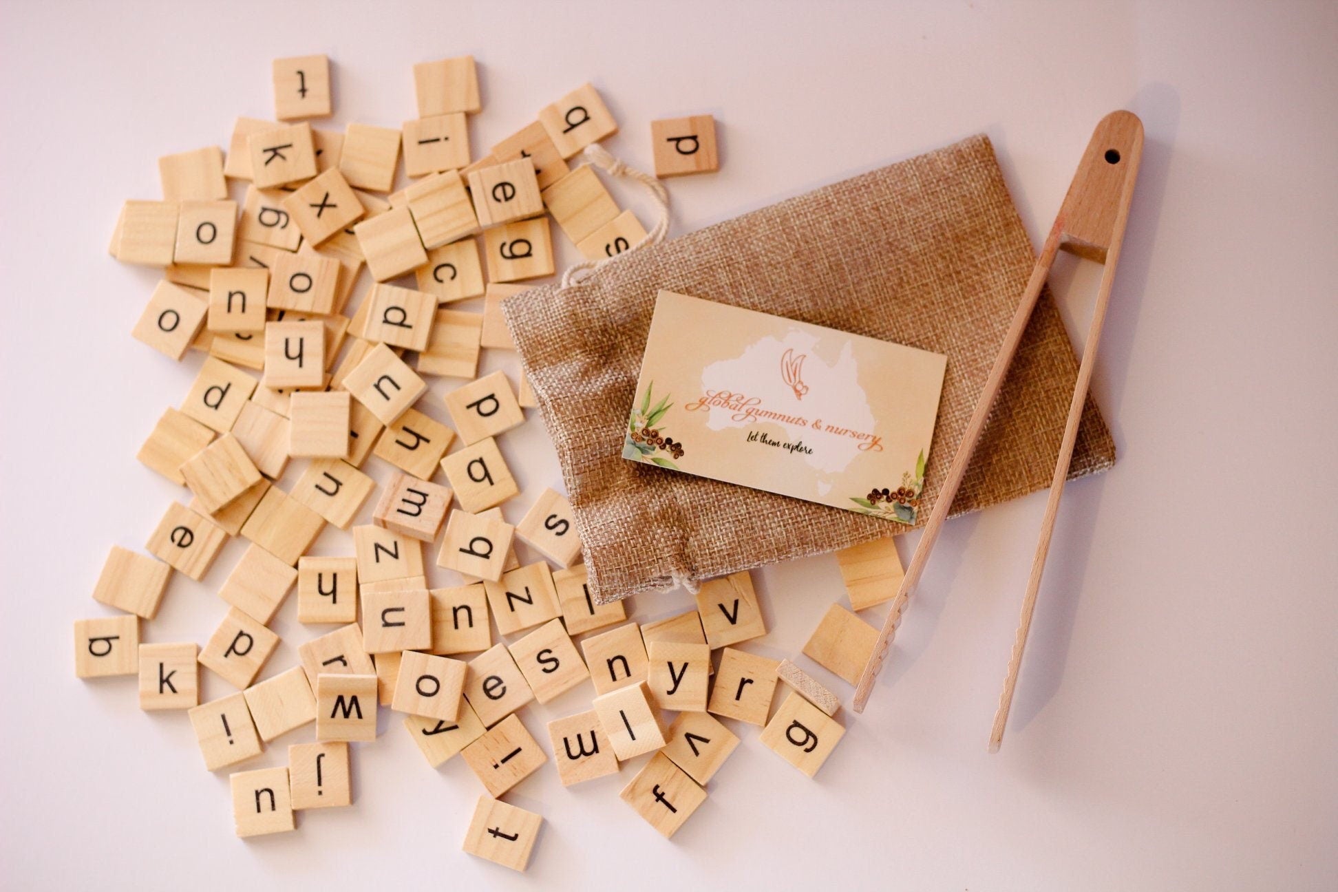 100 Lowercase Tiles: Wooden lowercase letter tiles for learning and activities.