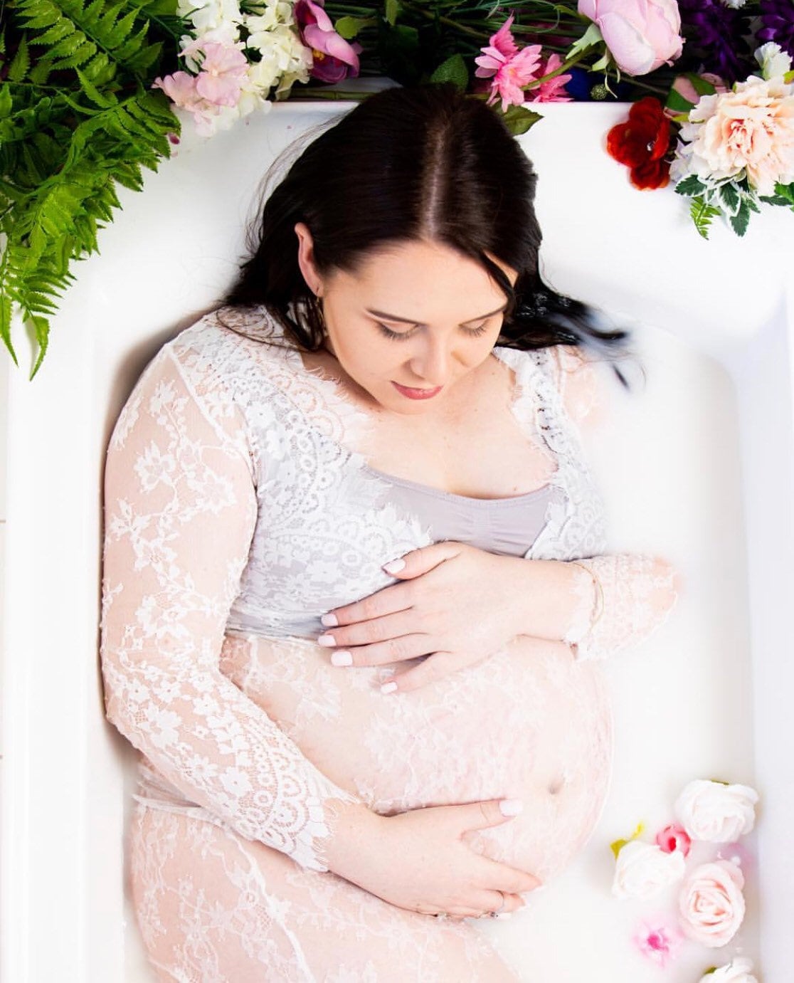 White stunning maternity lace dress, perfect for photoshoot style.