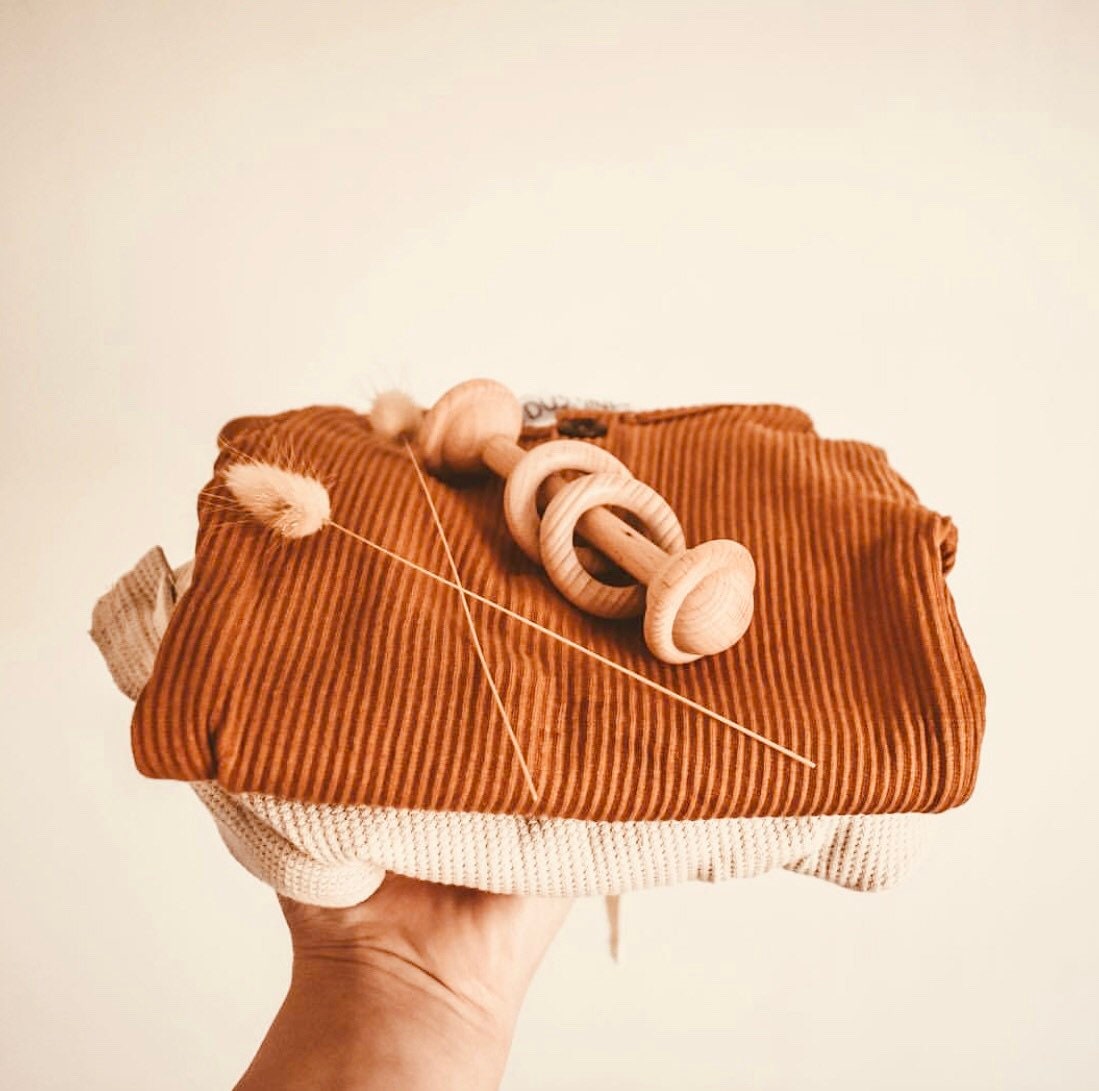 Natural baby rattle, a beautifully crafted, eco-friendly toy for little ones.
