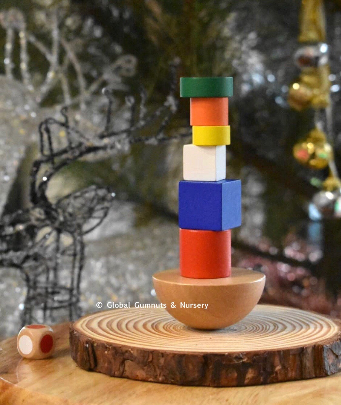 Colorful 8-piece wooden geometric block balancing game. Perfect for improving motor skills and encouraging STEM learning through play.