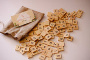 100 Lowercase Tiles: Wooden lowercase letter tiles for learning and activities.