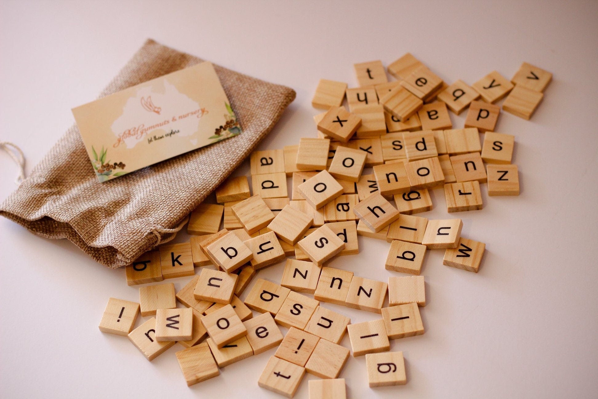 100 Lowercase Tiles: Wooden lowercase letter tiles for learning and activities.