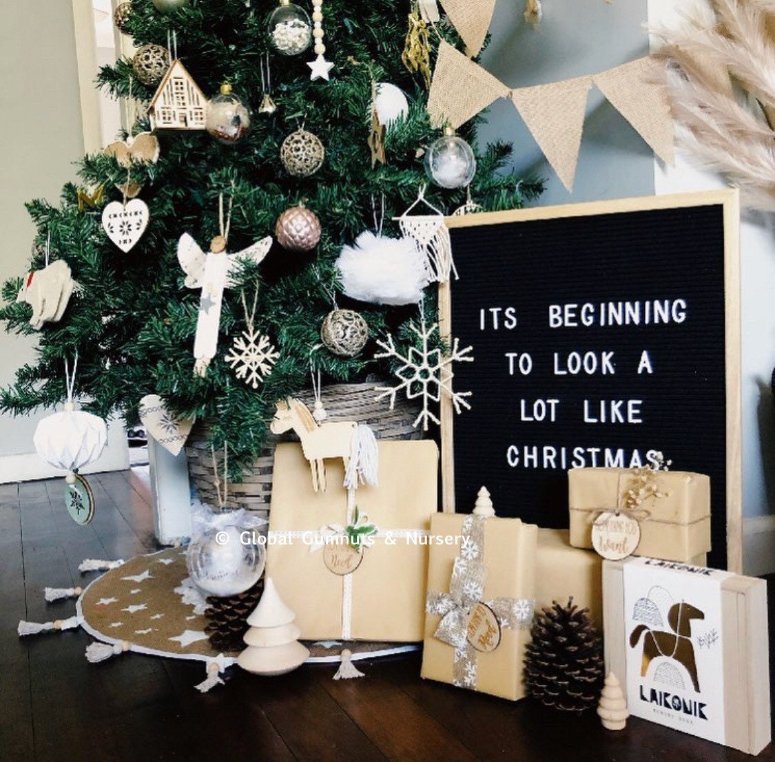 Unicorn Tassel Ornament: Wooden unicorn ornament with tassels and beads for holiday decor.