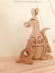 Wooden kangaroo, crafted from natural beech wood for play gyms or pocket gifts.
