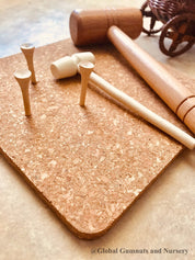CORK and Tools Set: Kids’ wooden hammer and nail set with corkboard and wooden nails for creative crafting and playdough fun.