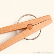 Wooden springy tongs, chopstick-like fun for kids or kitchen use.
