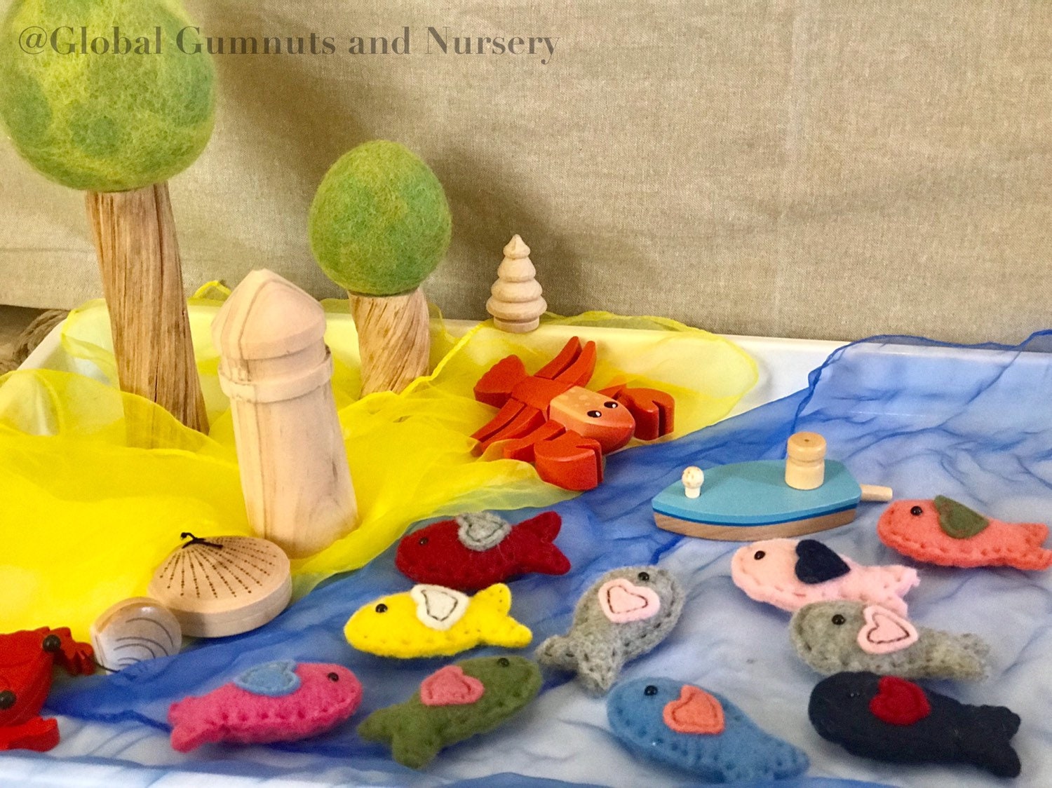 Wool and felt fish, a soft and playful crafting or learning resource.