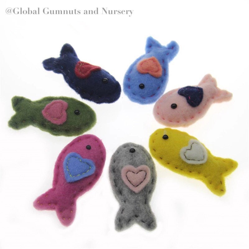 Wool and felt fish, a soft and playful crafting or learning resource.