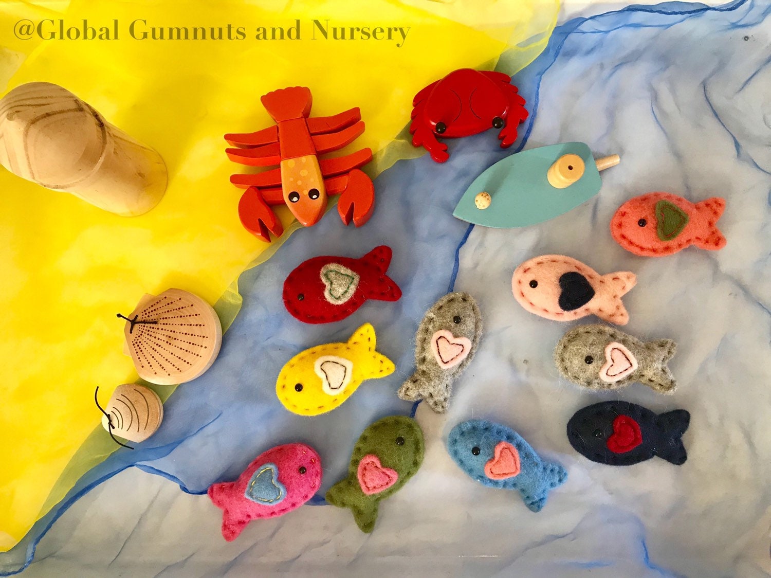 Wool and felt fish, a soft and playful crafting or learning resource.