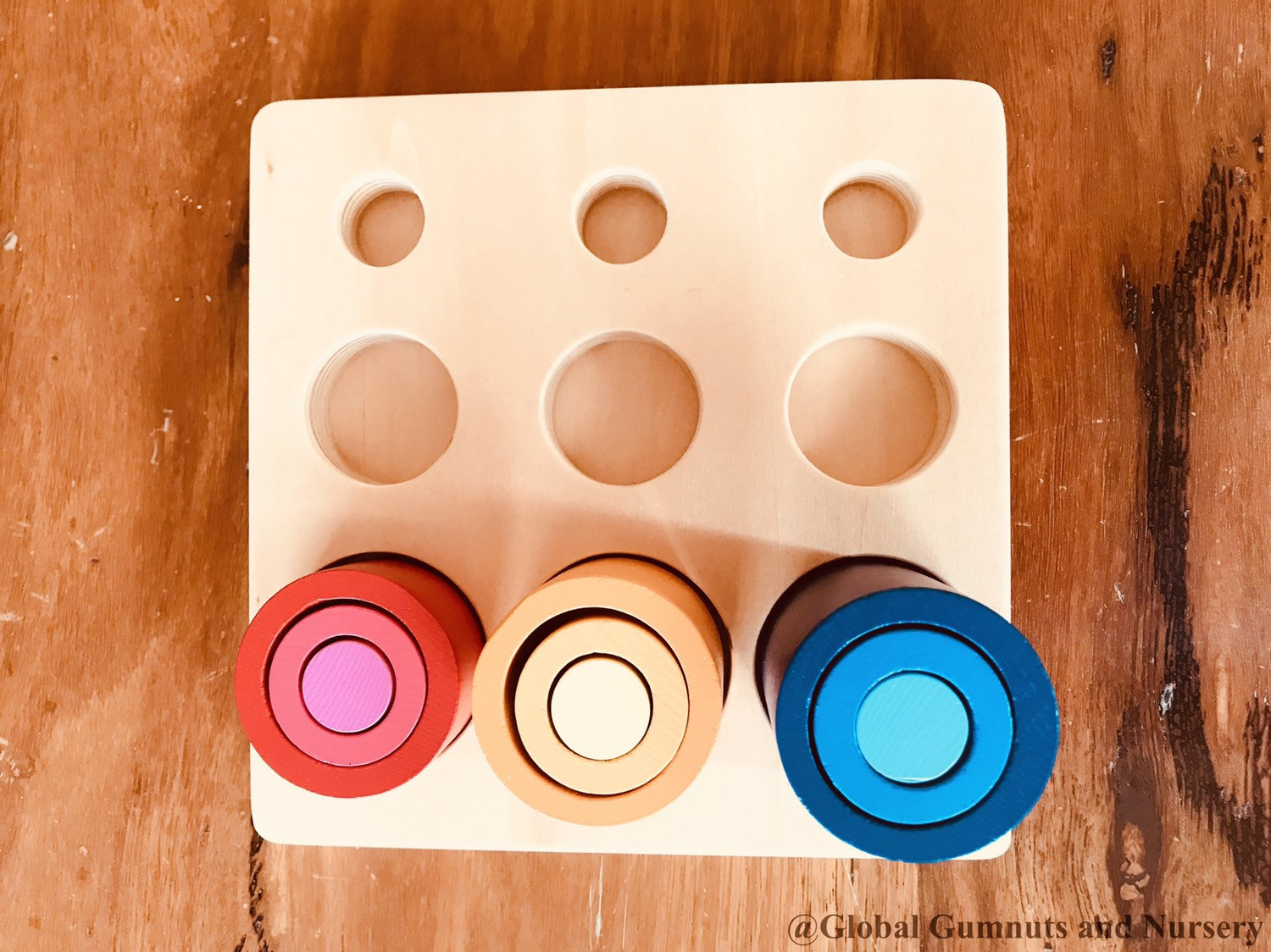 Cylinder block puzzle, an educational Montessori tool for developing spatial awareness and fine motor skills.