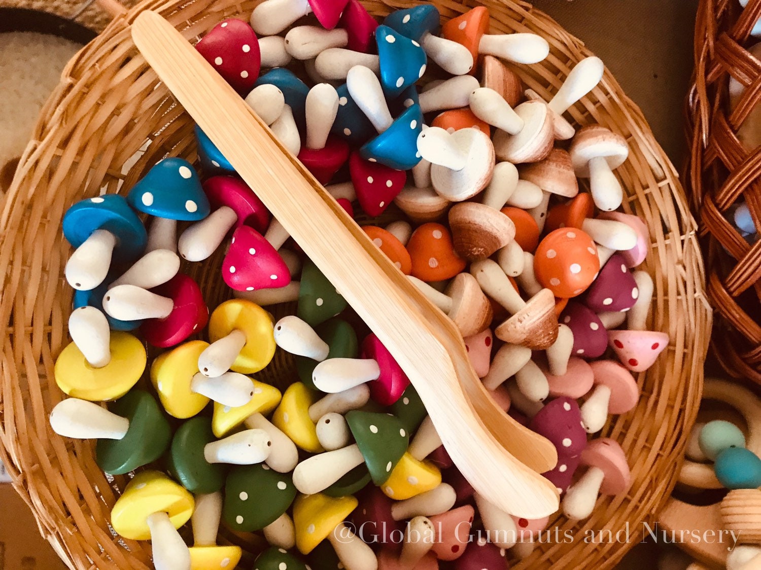 Wooden Toddler Tongs: Curved wooden tongs designed for toddlers' motor skill development.
