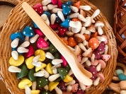 Wooden Toddler Tongs: Curved wooden tongs designed for toddlers' motor skill development.