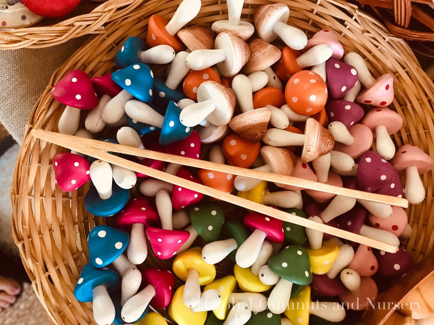 Wooden Toddler Tongs: Curved wooden tongs designed for toddlers' motor skill development.